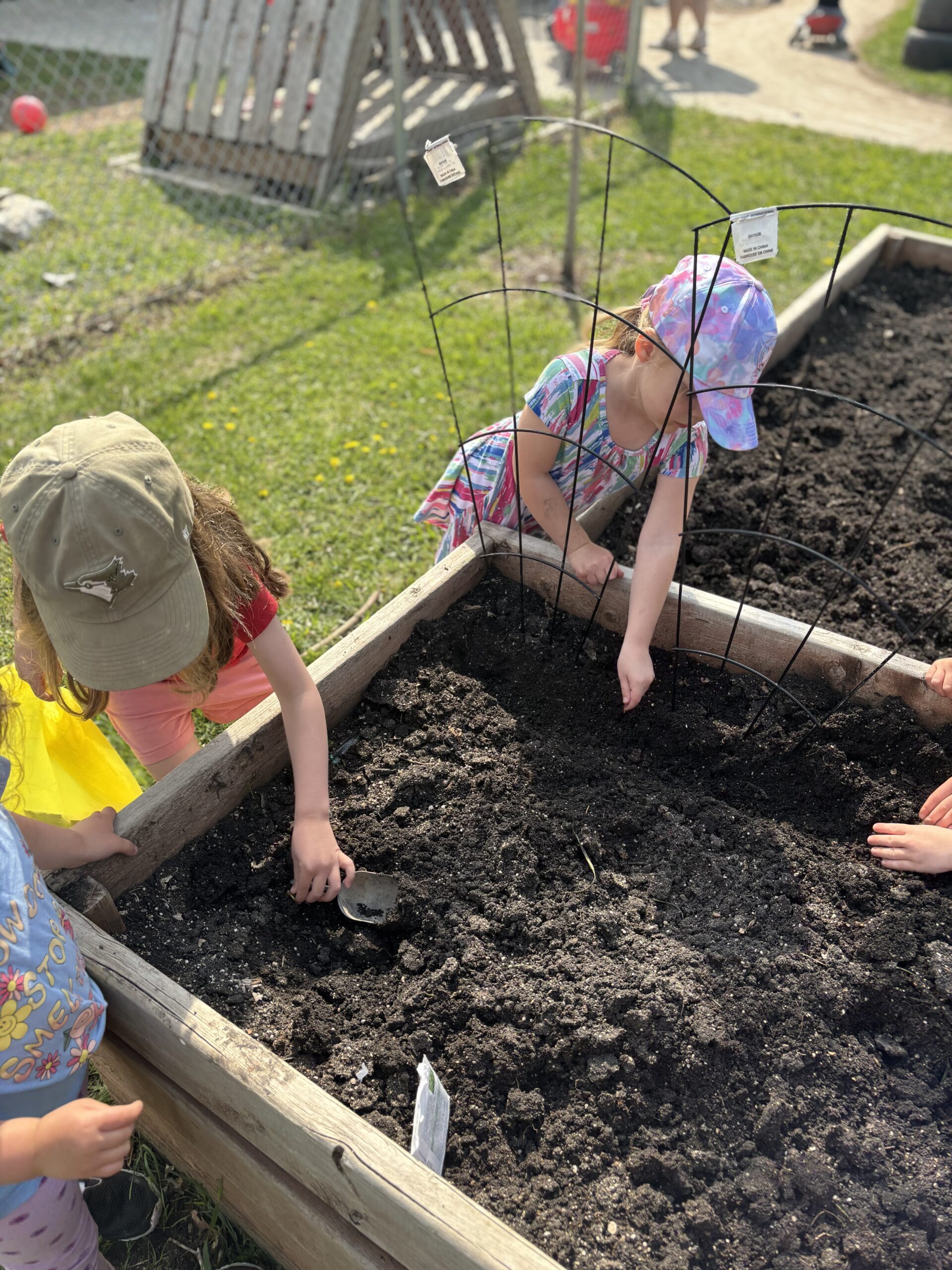 kids playing in soil outside