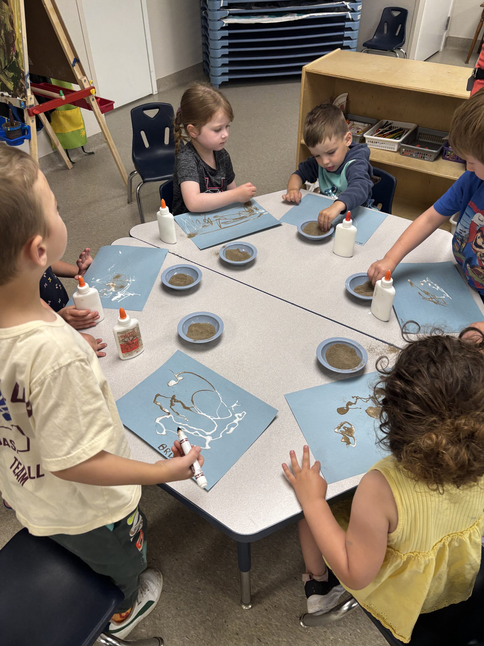 children doing crafts at the table