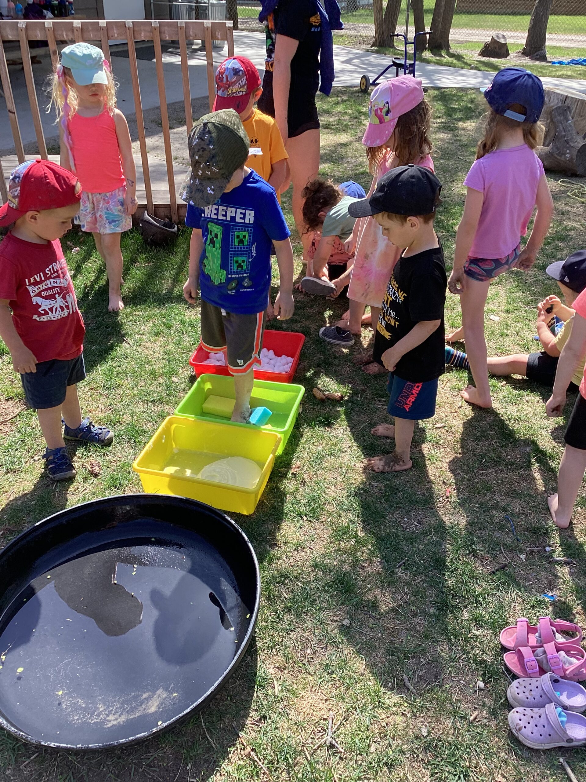 kids playing in water toys outside